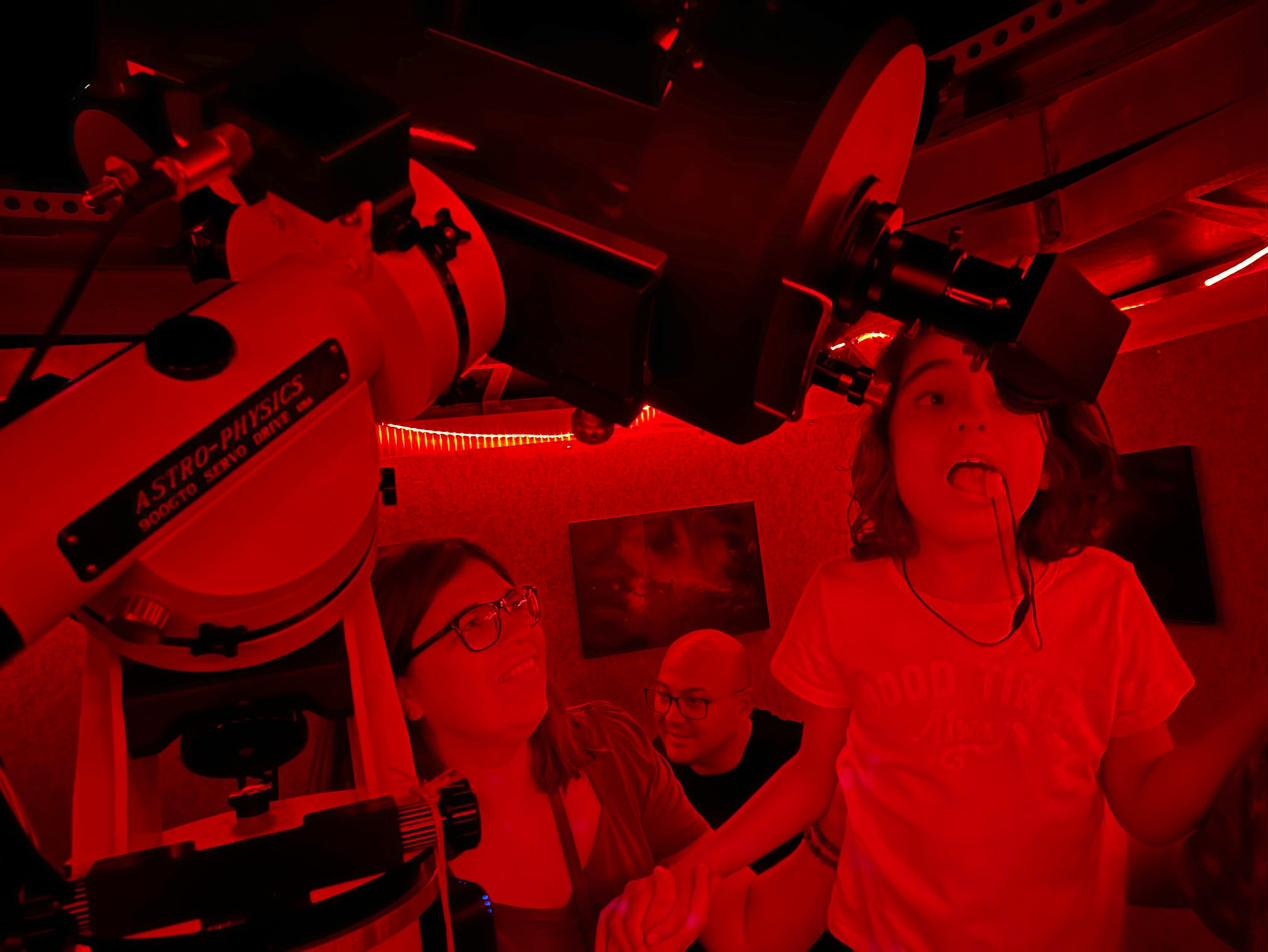 Young visitors with telescopes